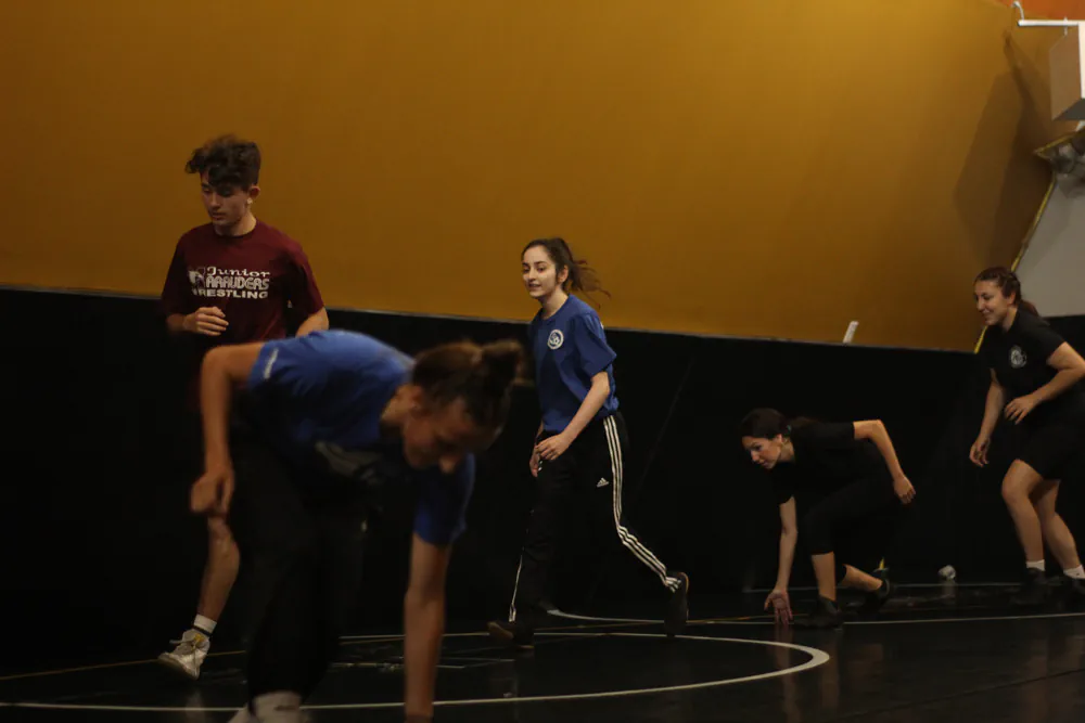 Jr. Marauders athletes warming up at practice